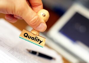 quality concept with stamp in business office and copyspace